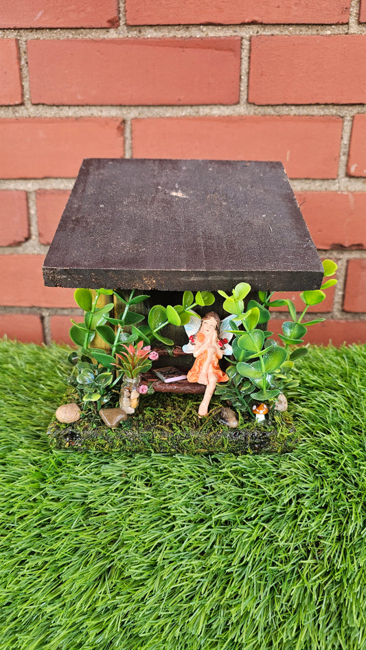 Hummingbird Home Fairy on Bench with flowers