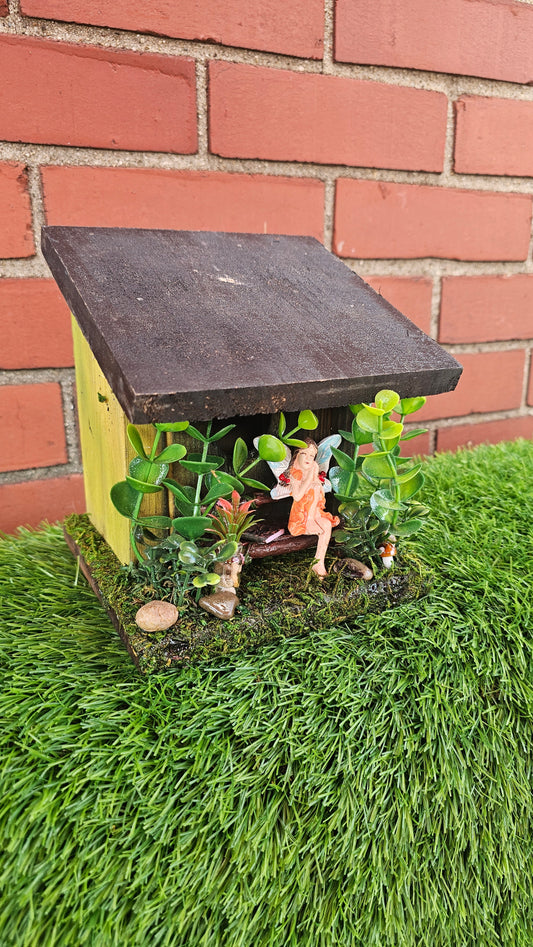 Hummingbird Home Fairy on Bench with flowers